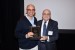 Dr. Nagib Callaos, General Chair, giving Dr. Octavio Orozco a plaque "Por su Excelente Ponencia Plenaria."